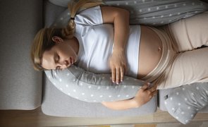 top view pregnant woman using nursing pillow 1