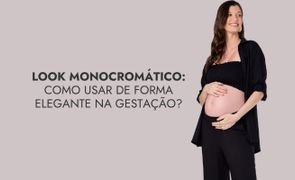 modelo com maos na barriga usando roupas pretas com escrito look monocromatico como usar de forma elegante na gestacao