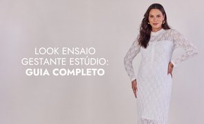 modelo com vestido branco de manga longa com escrito look ensaio gestante estudio guia completo